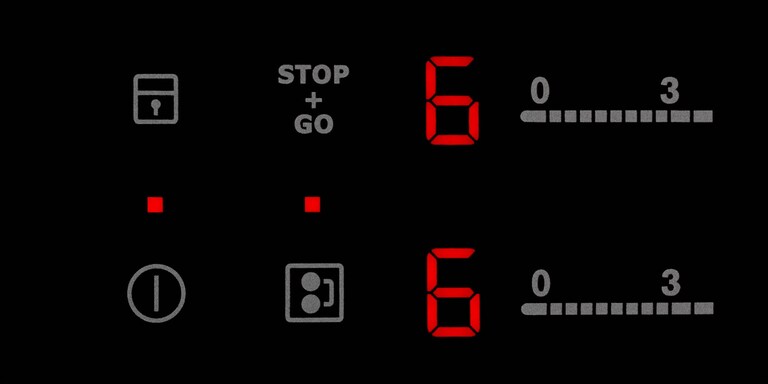 The stop and go button on an Electrolux induction hob